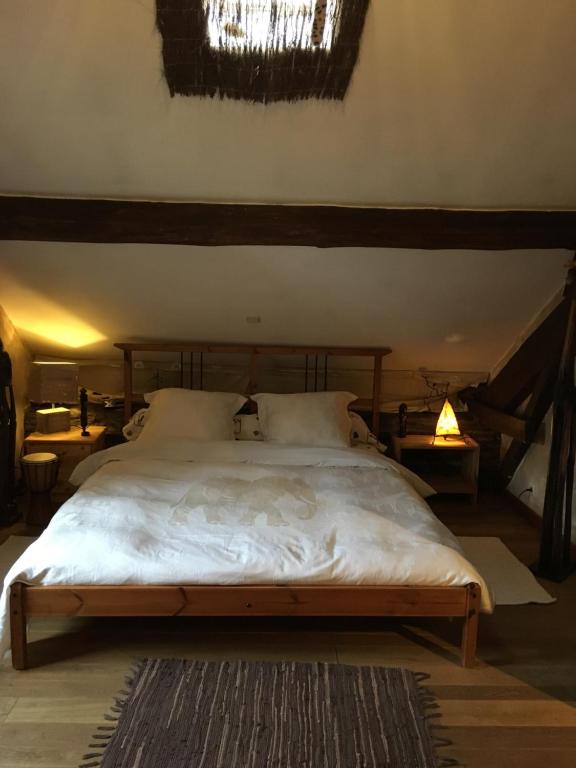 Ένα ή περισσότερα κρεβάτια σε δωμάτιο στο l'émiline