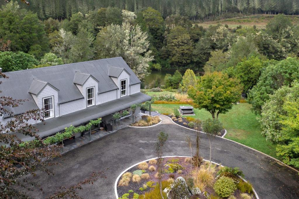 an aerial view of a house with a garden at Maruia River Retreat in Shenandoah