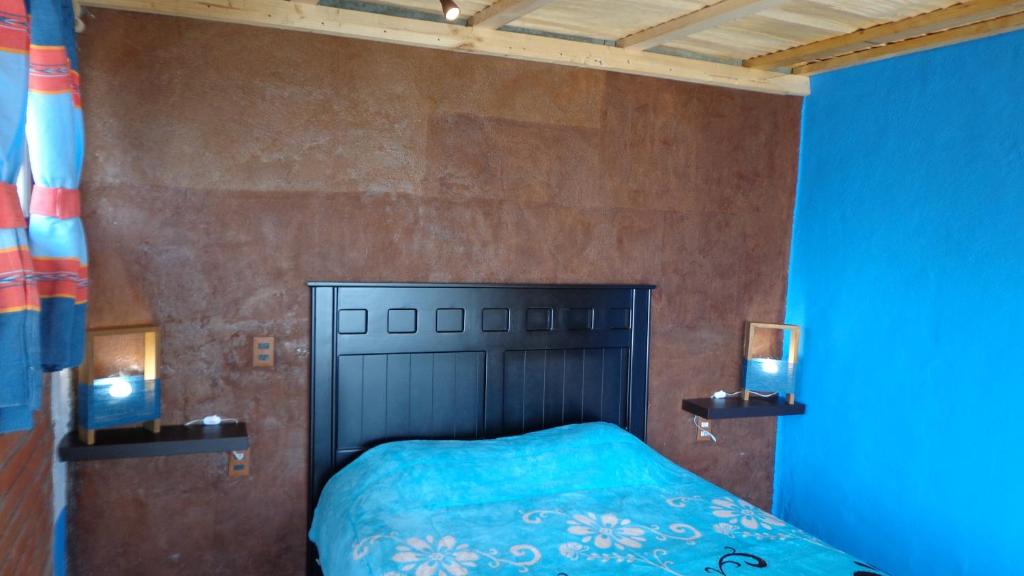 Postel nebo postele na pokoji v ubytování ZIRAHUÉN CUIN Habitaciones Rústicas