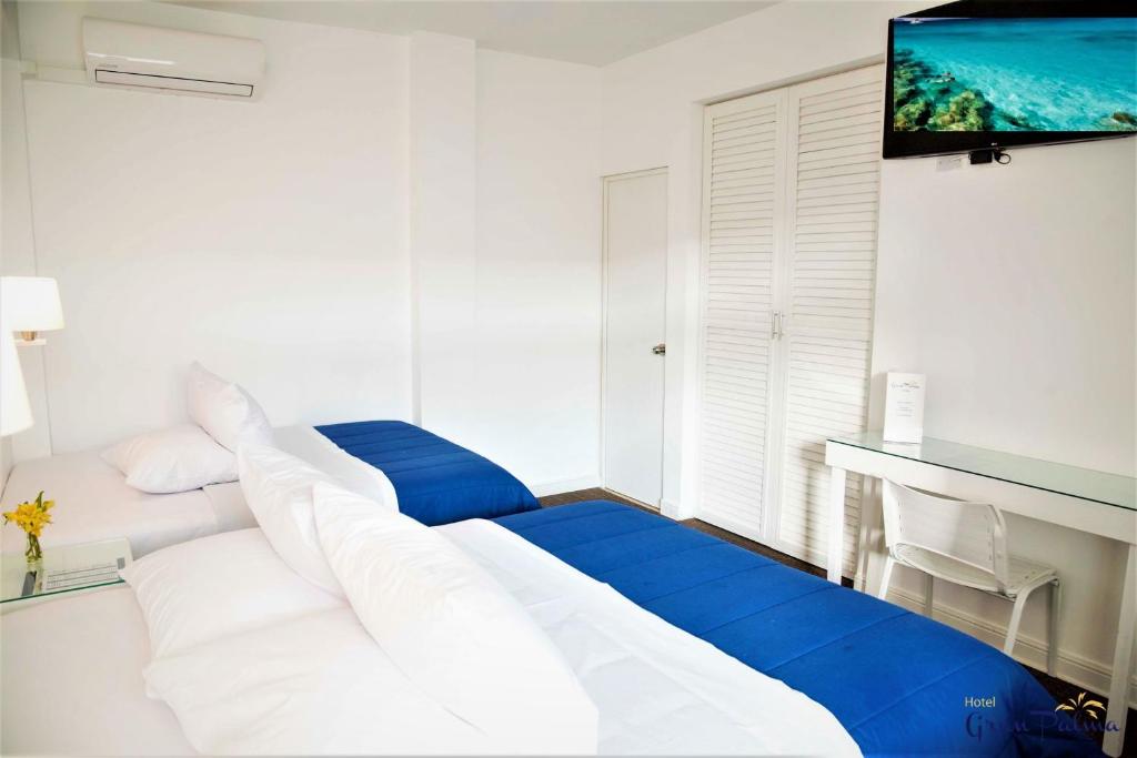 Postel nebo postele na pokoji v ubytování Hotel Gran Palma Piura