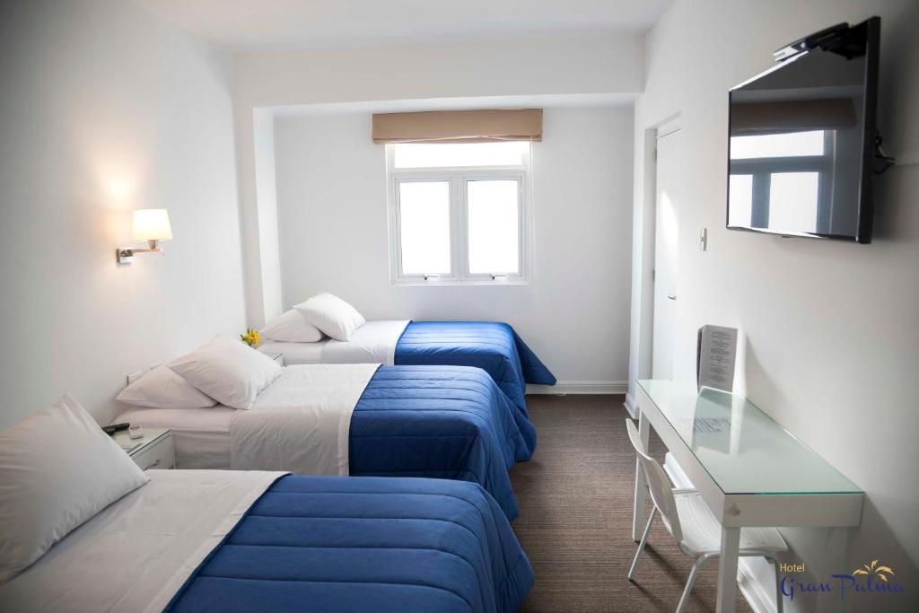 Postel nebo postele na pokoji v ubytování Hotel Gran Palma Piura