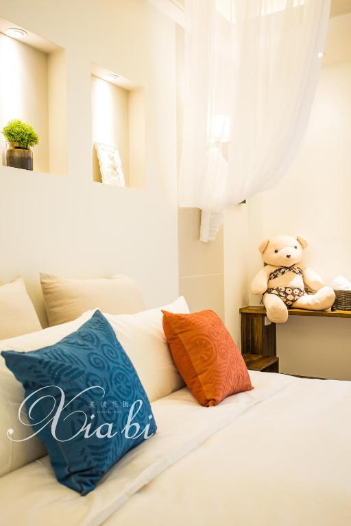 Postel nebo postele na pokoji v ubytování Xia Bi Garden Wedding B&B