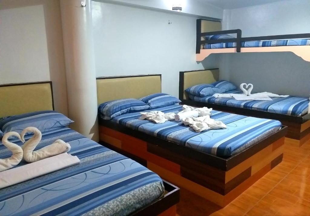 Postel nebo postele na pokoji v ubytování AMBIANZA APARTELLE