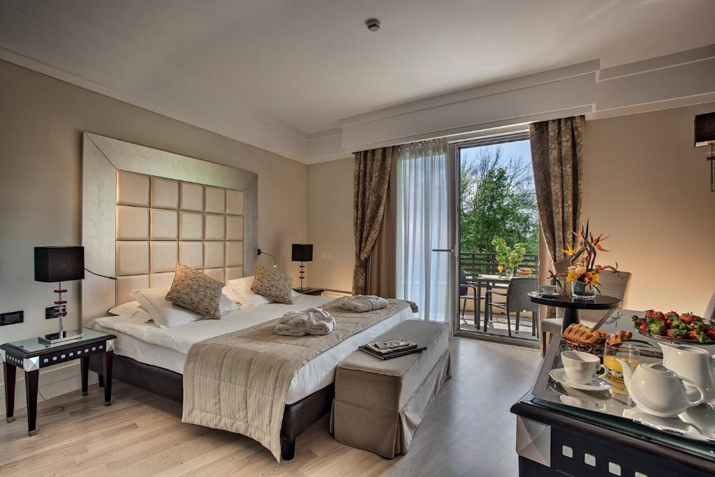 Posteľ alebo postele v izbe v ubytovaní Park Hotel Junior