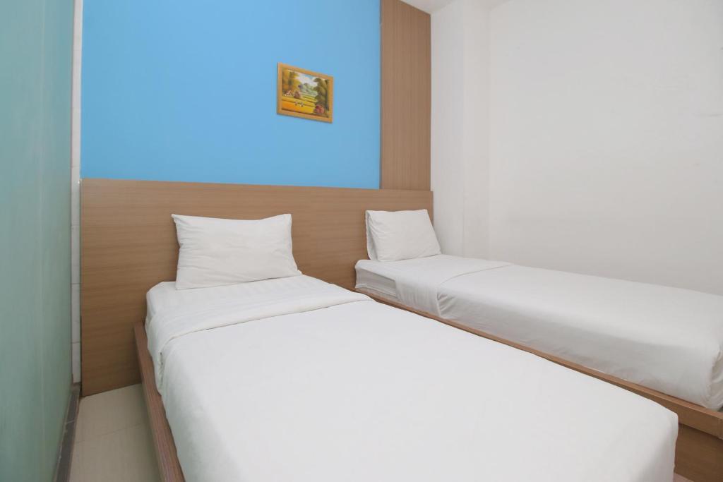 Postel nebo postele na pokoji v ubytování Residence100