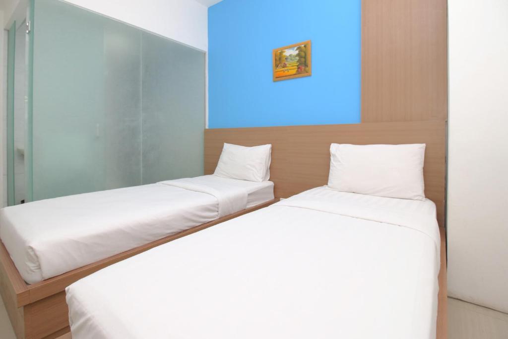Postel nebo postele na pokoji v ubytování Residence100