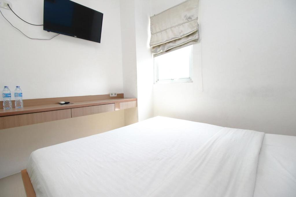 Postel nebo postele na pokoji v ubytování Residence100