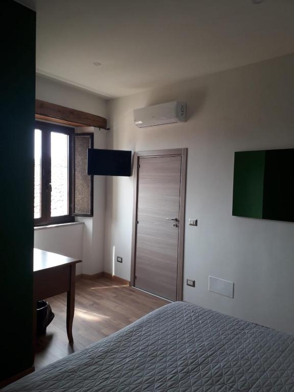 Posteľ alebo postele v izbe v ubytovaní B&B Le Vie del Borgo