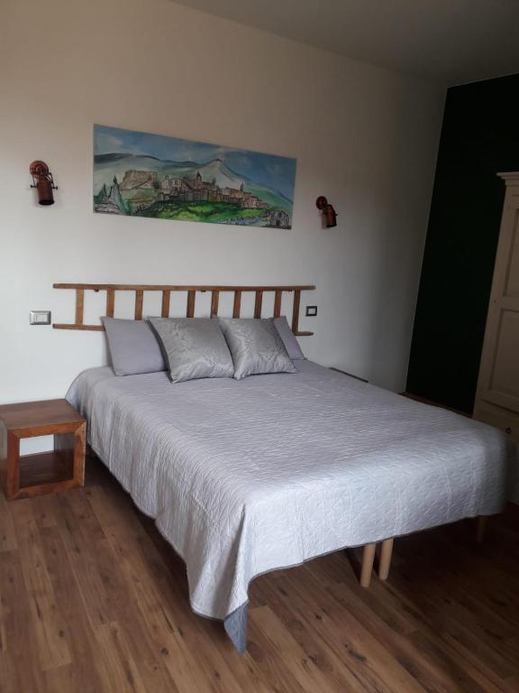Posteľ alebo postele v izbe v ubytovaní B&B Le Vie del Borgo