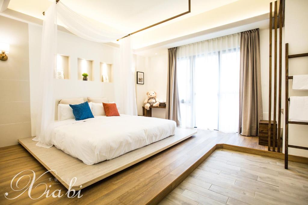 Postel nebo postele na pokoji v ubytování Xia Bi Garden Wedding B&B