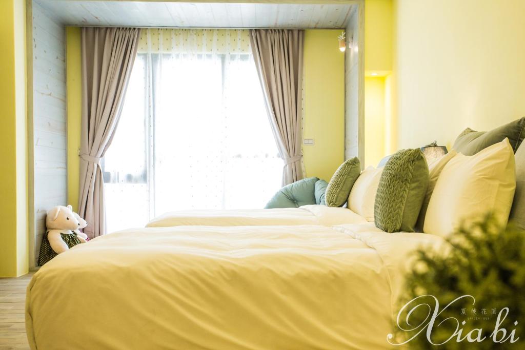 Postel nebo postele na pokoji v ubytování Xia Bi Garden Wedding B&B