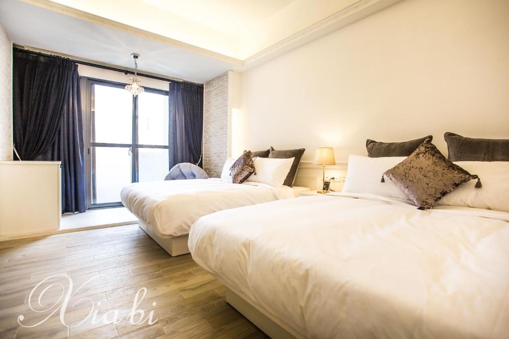 Postel nebo postele na pokoji v ubytování Xia Bi Garden Wedding B&B