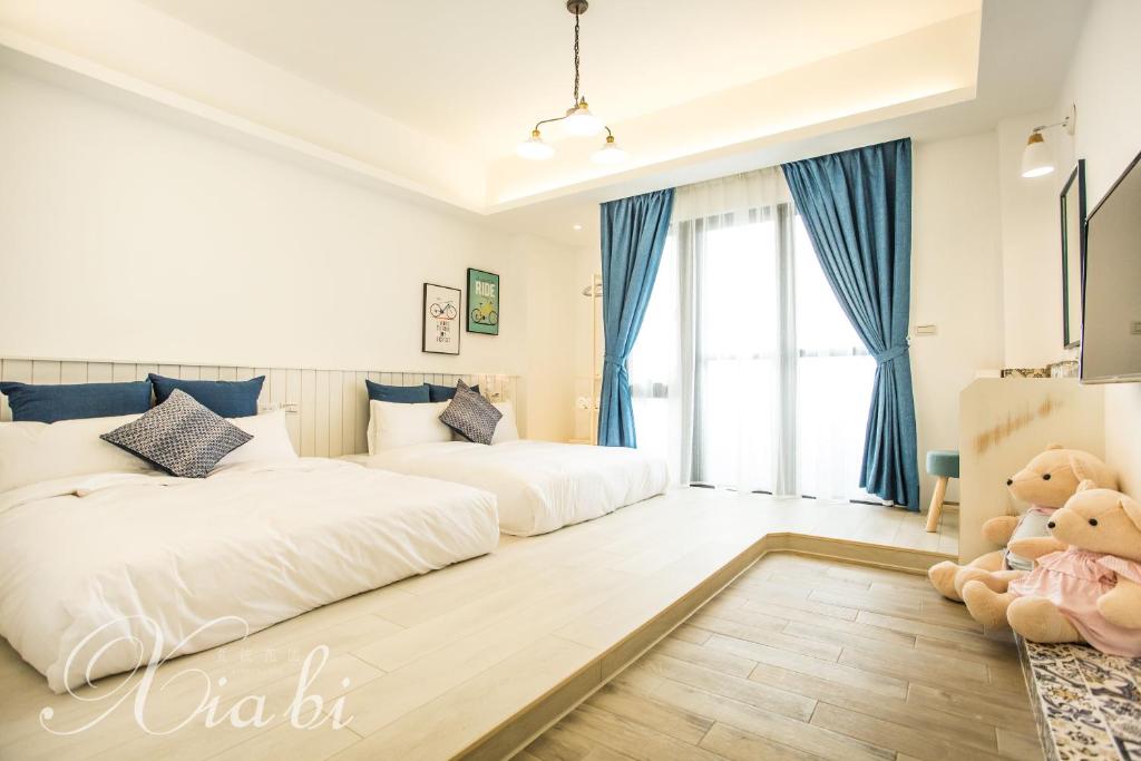 Postel nebo postele na pokoji v ubytování Xia Bi Garden Wedding B&B