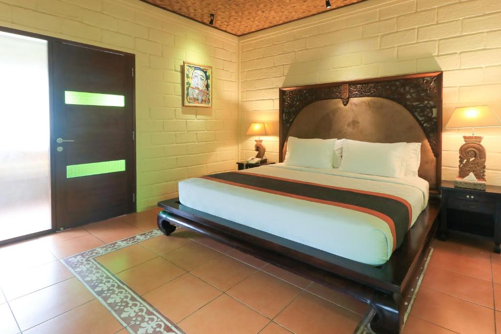 Letto o letti in una camera di Munari Resort Ubud