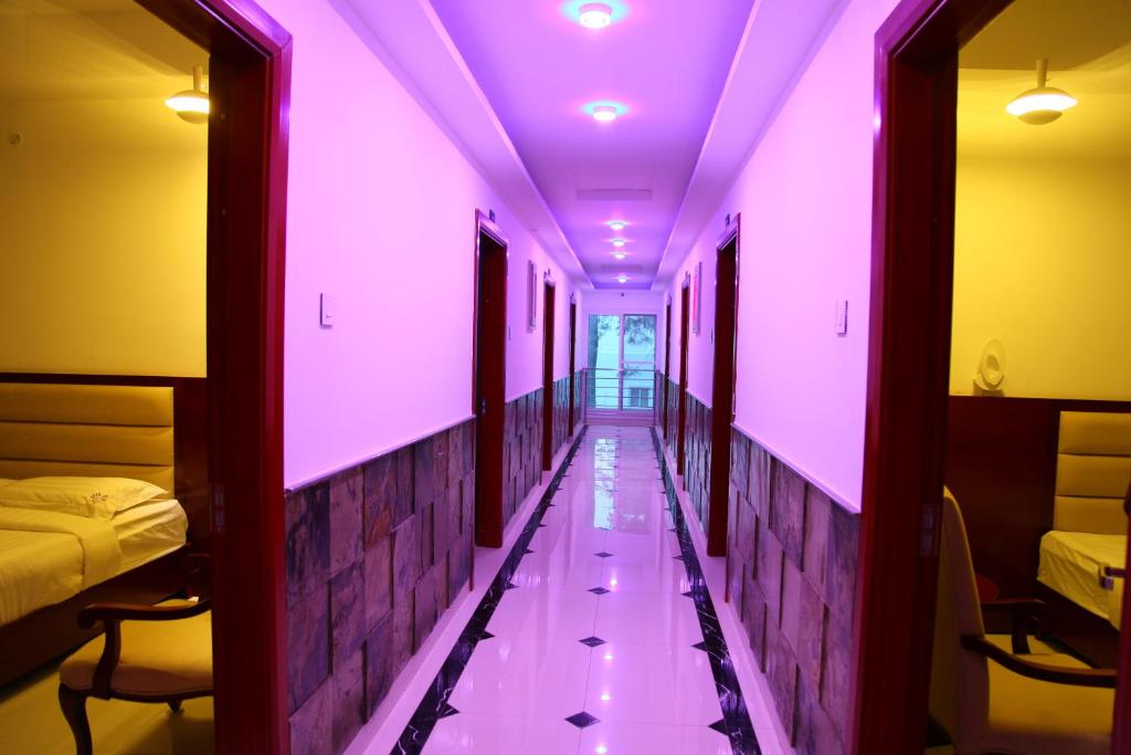 Postel nebo postele na pokoji v ubytování Hotel Aradhana Inn