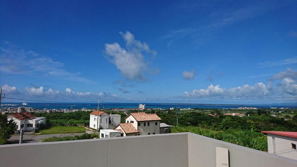 a view of the ocean from a balcony of a house at VACANCE club in Ishigaki Island