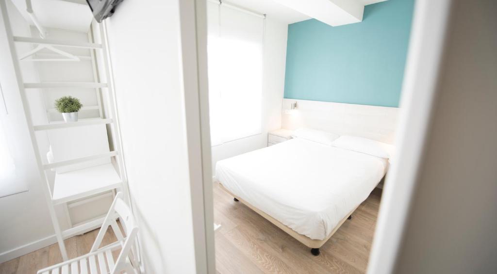 Posteľ alebo postele v izbe v ubytovaní Happy Hostal Carrales