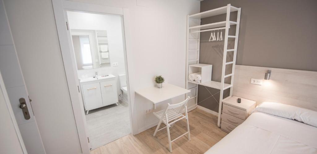 Posteľ alebo postele v izbe v ubytovaní Happy Hostal Carrales