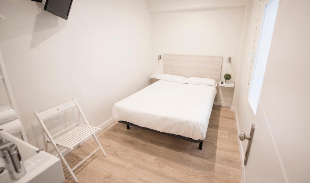 Posteľ alebo postele v izbe v ubytovaní Happy Hostal Carrales