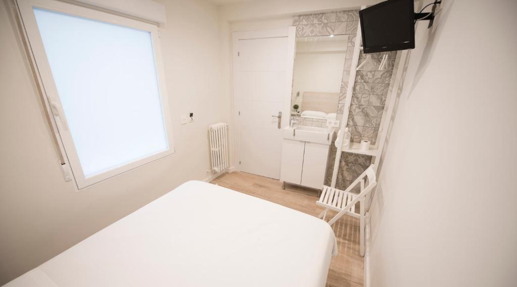 Posteľ alebo postele v izbe v ubytovaní Happy Hostal Carrales