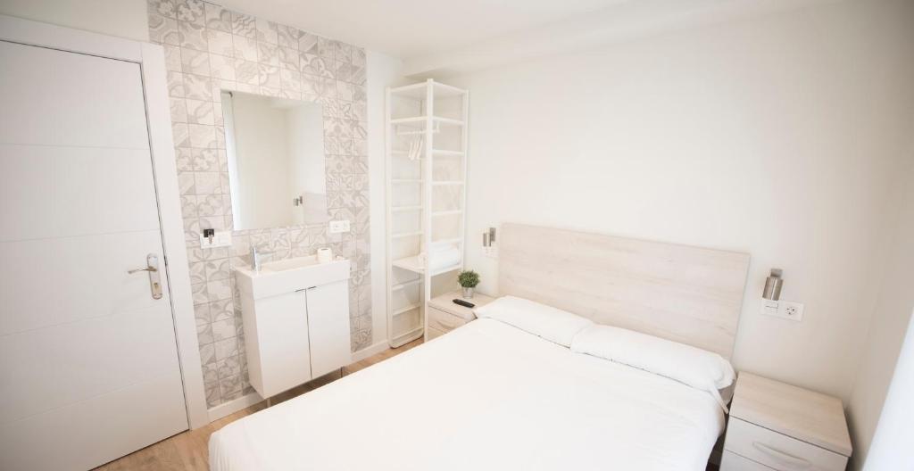 Posteľ alebo postele v izbe v ubytovaní Happy Hostal Carrales