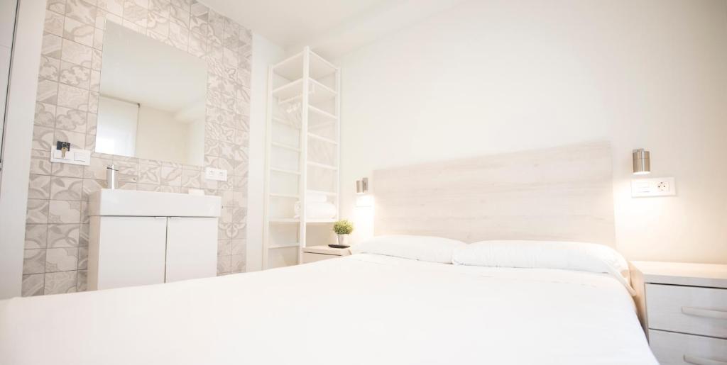 Posteľ alebo postele v izbe v ubytovaní Happy Hostal Carrales