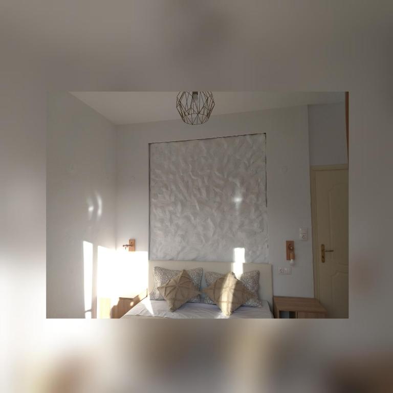 Posteľ alebo postele v izbe v ubytovaní Greek Blue Apartment