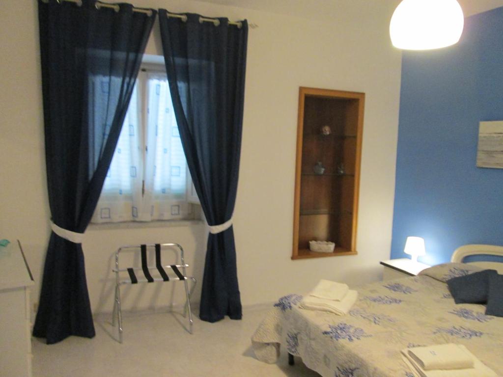 Łóżko lub łóżka w pokoju w obiekcie Casa Margherita