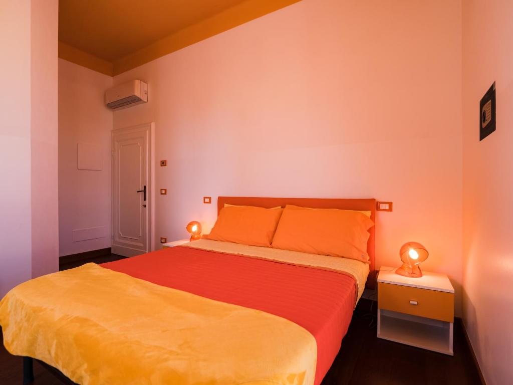 A bed or beds in a room at B&B VILLA TOZZA