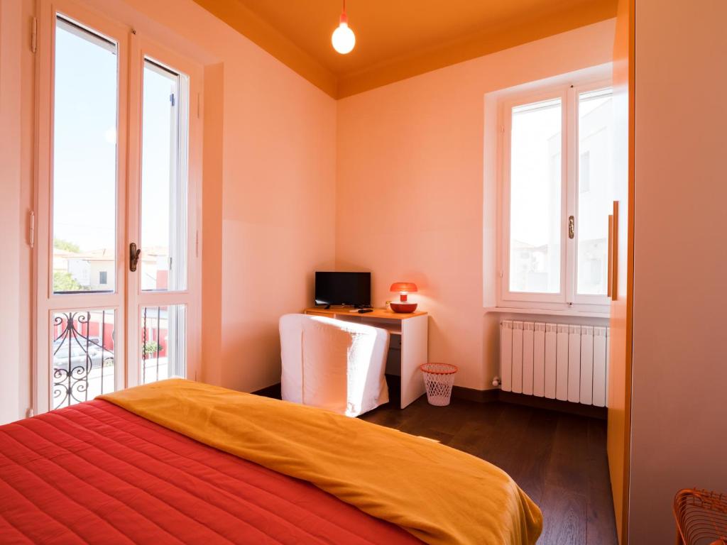 A bed or beds in a room at B&B VILLA TOZZA