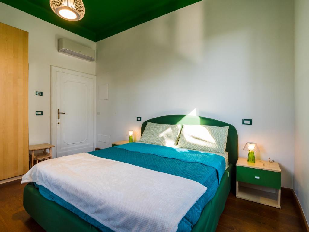 A bed or beds in a room at B&B VILLA TOZZA