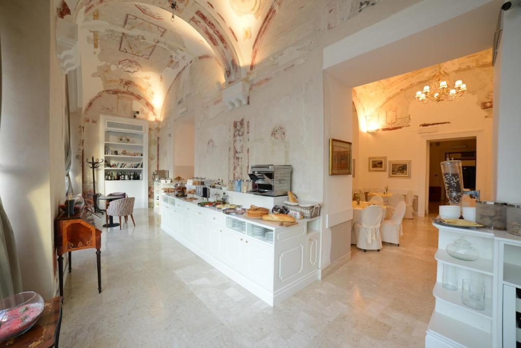 Kuchyň nebo kuchyňský kout v ubytování Hotel Vittoria