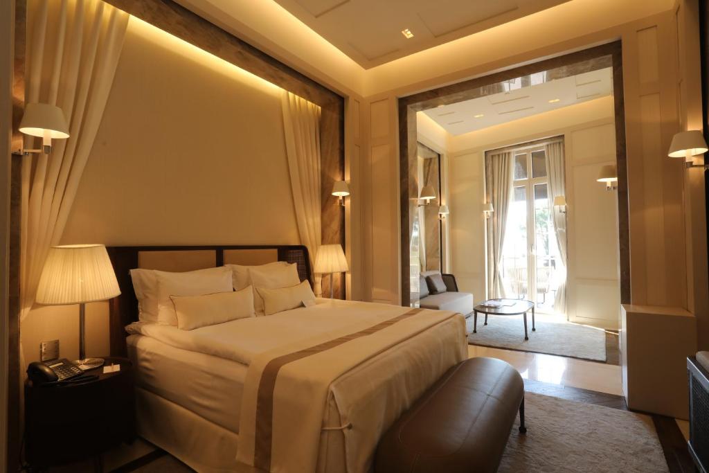 a hotel room with a large bed and a window at Kemer Country Hotel İstanbul in Istanbul
