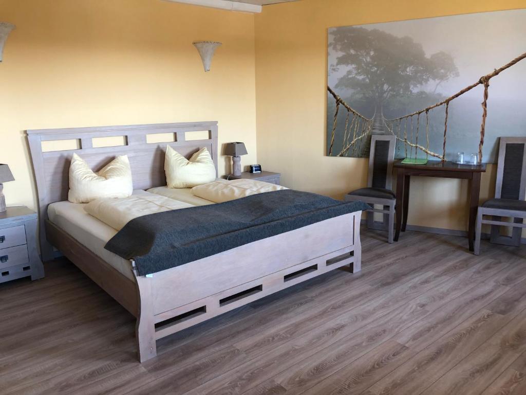 Postel nebo postele na pokoji v ubytování Hotel Rabenstein