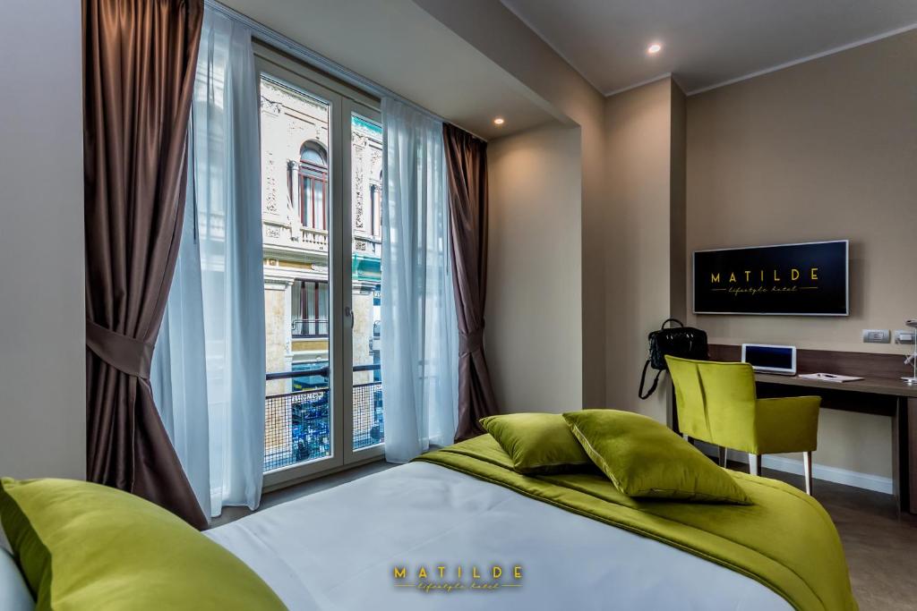TV a/nebo společenská místnost v ubytování Hotel Matilde - Lifestyle Hotel