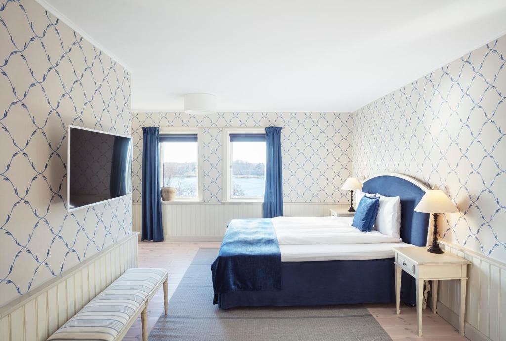 Postel nebo postele na pokoji v ubytování Hotel Bretagne