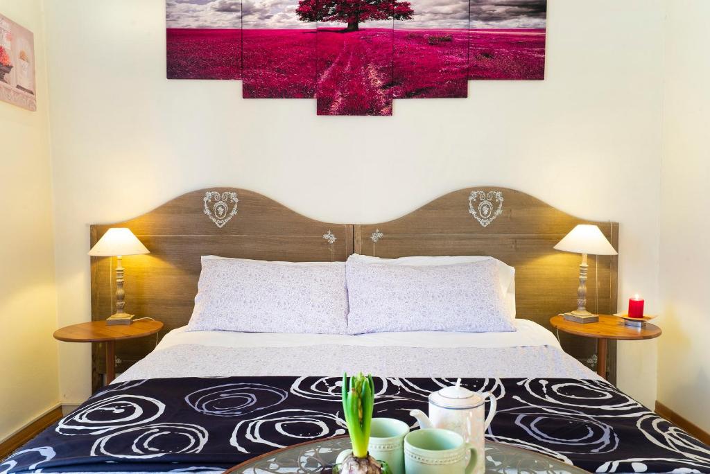 Postel nebo postele na pokoji v ubytování 1900 Artevita B&B