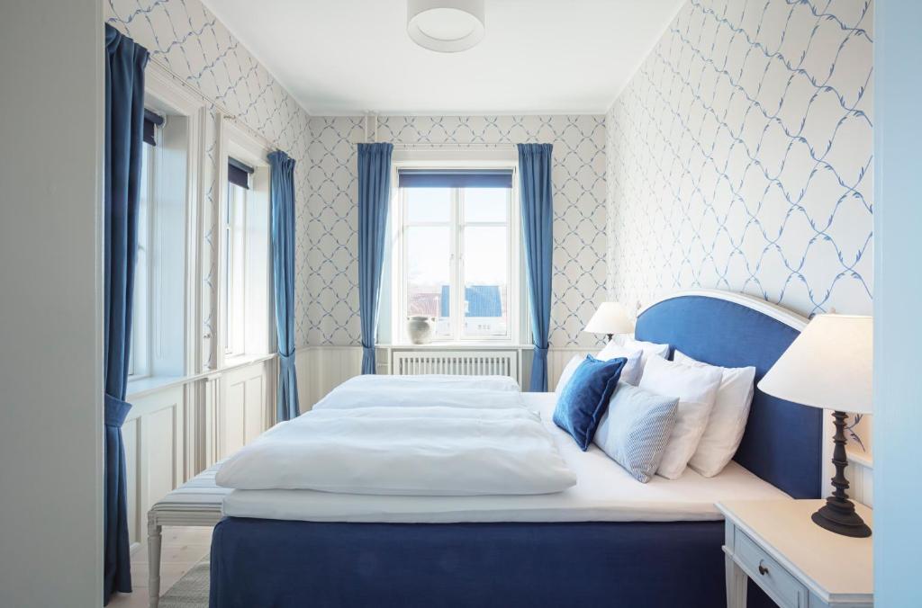 Postel nebo postele na pokoji v ubytování Hotel Bretagne