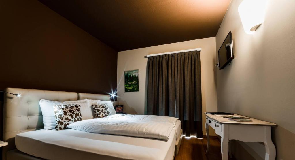 Postel nebo postele na pokoji v ubytování Hotel Biobistro Semadeni