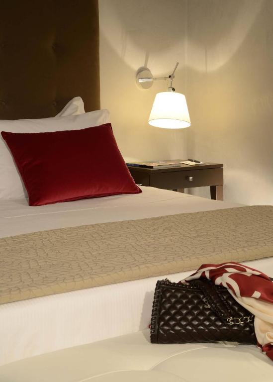 Postel nebo postele na pokoji v ubytování Colonna Palace Hotel