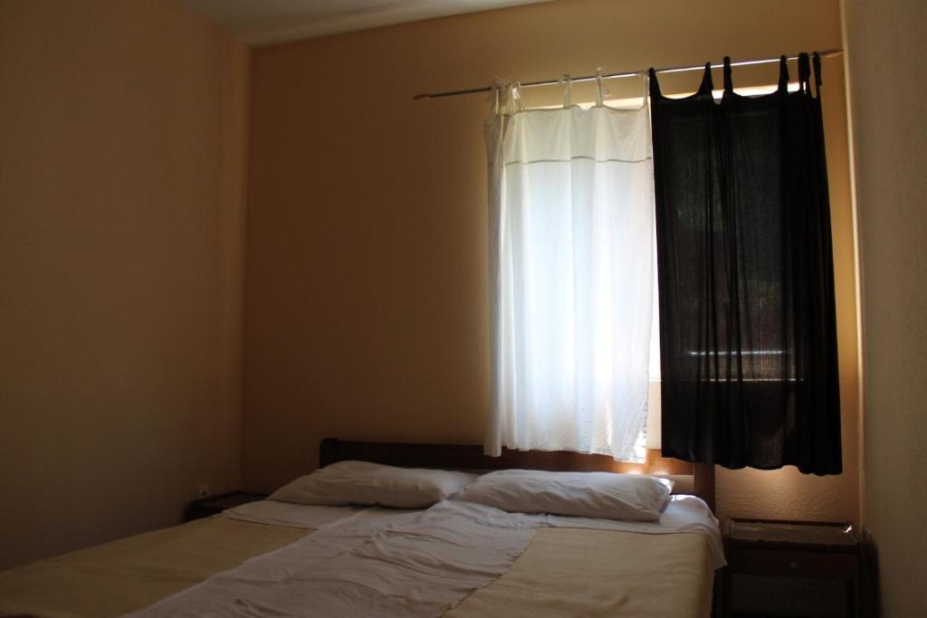 Łóżko lub łóżka w pokoju w obiekcie Apartments Isabela
