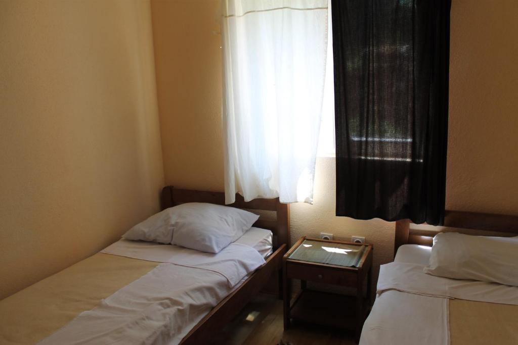 Łóżko lub łóżka w pokoju w obiekcie Apartments Isabela