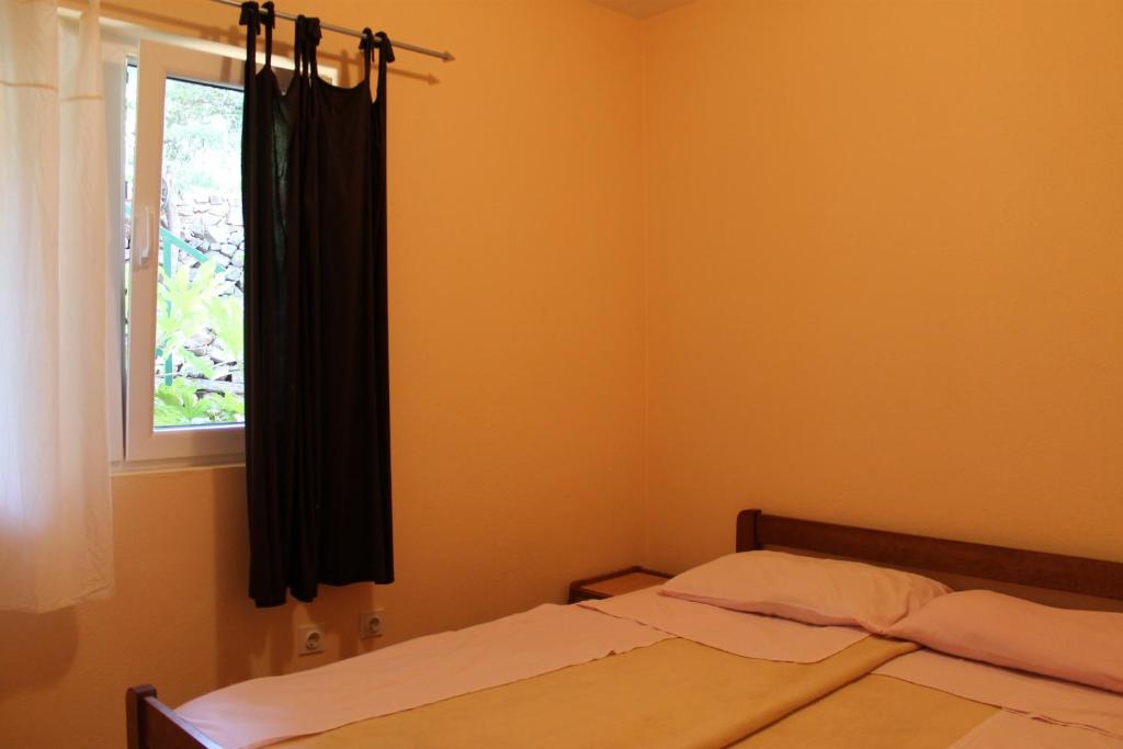 Łóżko lub łóżka w pokoju w obiekcie Apartments Isabela