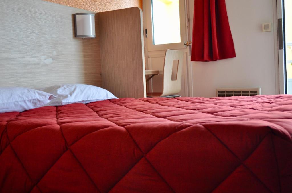 Postel nebo postele na pokoji v ubytování Premiere Classe Sete - Balaruc