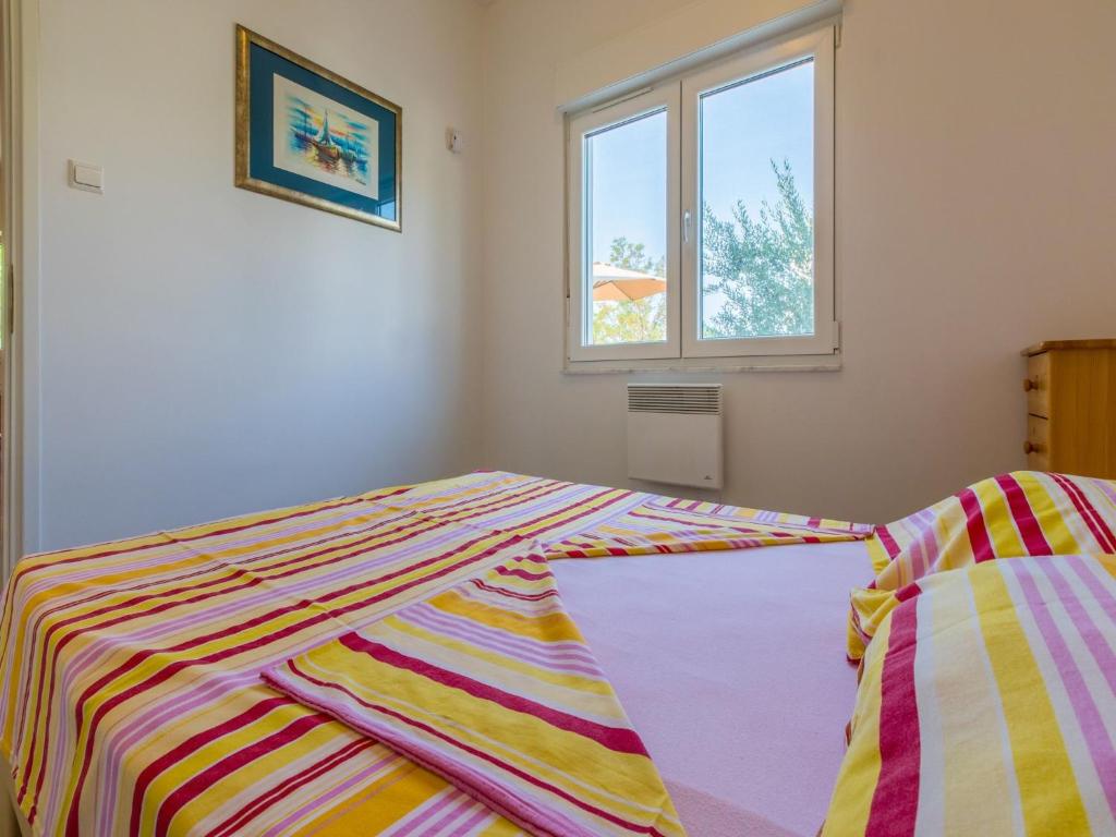 Postel nebo postele na pokoji v ubytování Apartments Ksenija