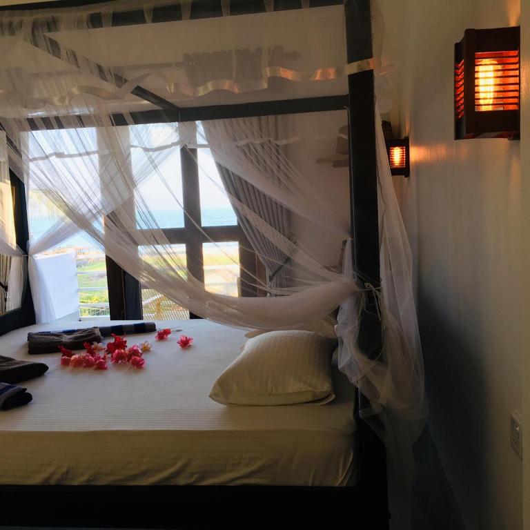 Postel nebo postele na pokoji v ubytování Cili Hotel