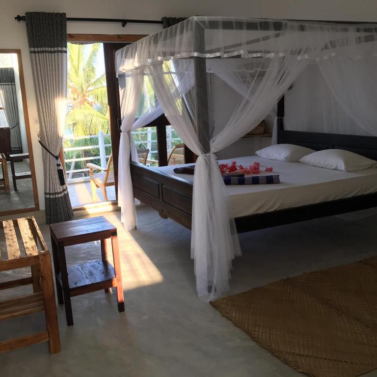 Postel nebo postele na pokoji v ubytování Cili Hotel