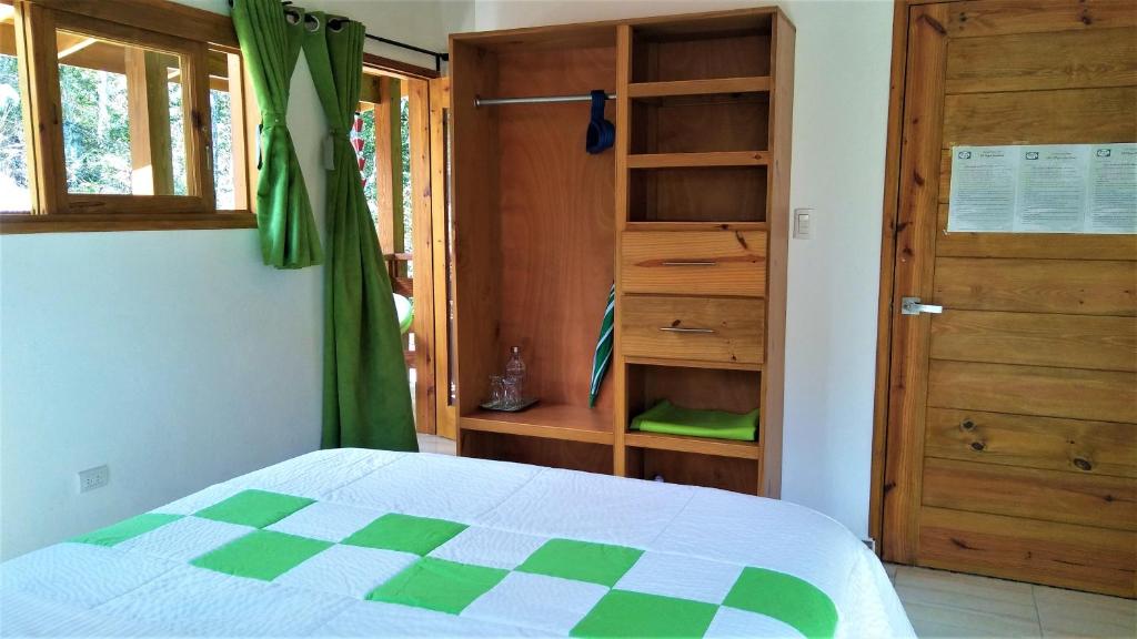 En eller flere senger på et rom på Mi Hogar Jarabacoa