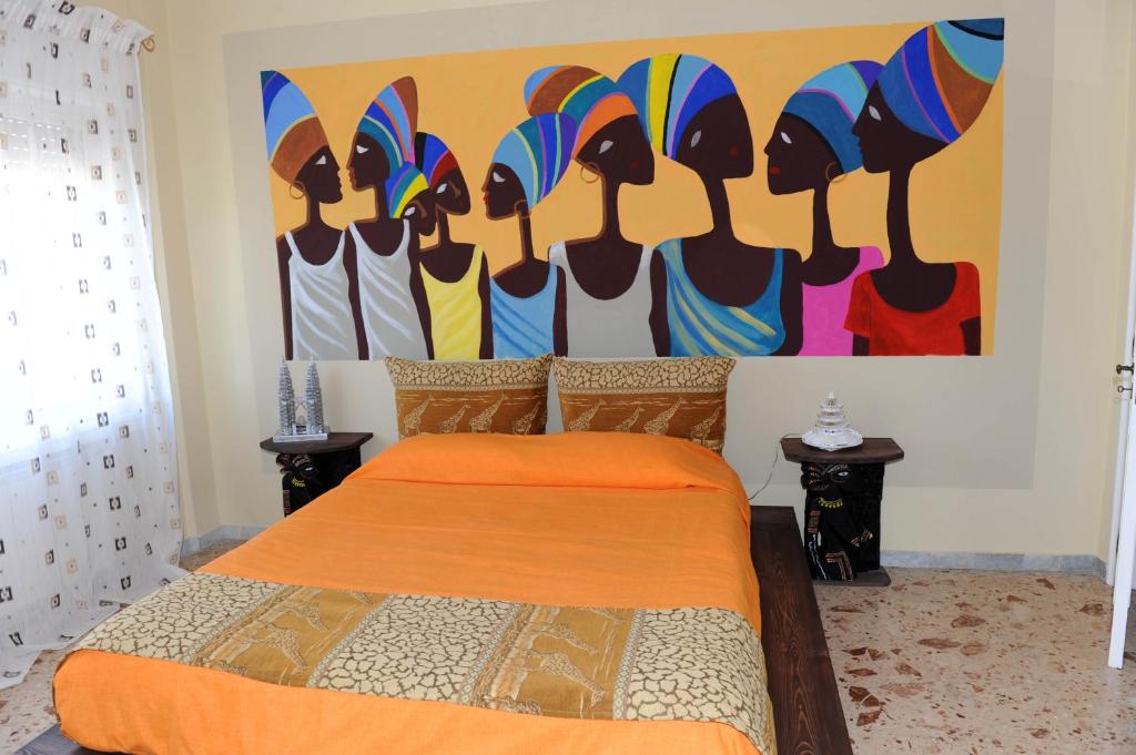Postel nebo postele na pokoji v ubytování B&B Il MappaMondo