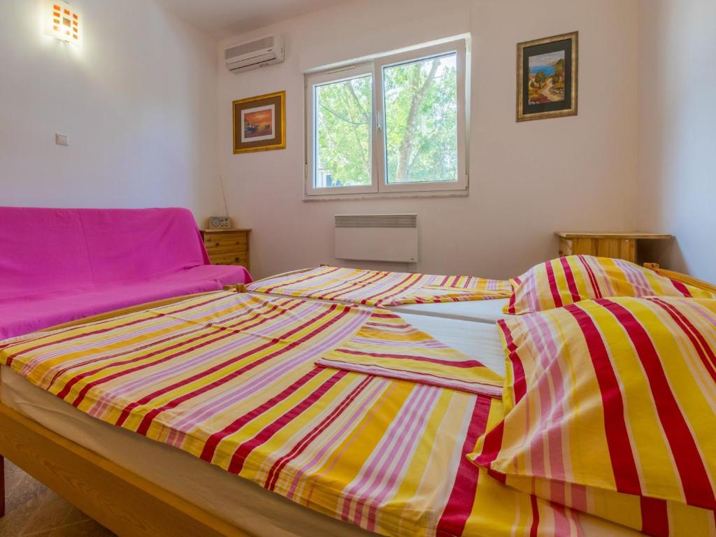 Postel nebo postele na pokoji v ubytování Apartments Ksenija